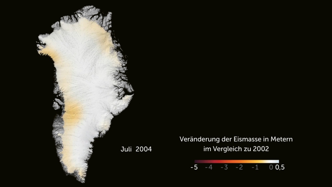 Grönland im Juli 2004. Die Insel ist mit leichten Gelbtönen im Südwesten und Norden gefärbt.
