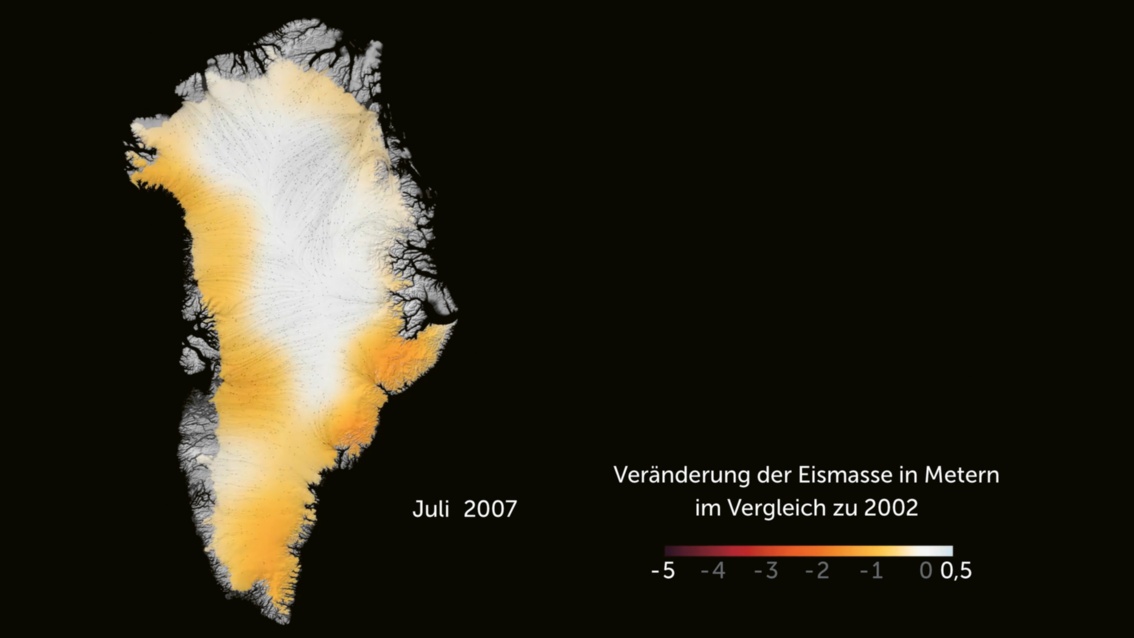 Grönland im Juli 2007. Die Insel ist mit leichten Gelbtönen im Südwesten und Norden gefärbt.